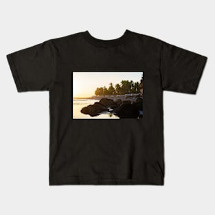 rocky beach and cliff with palm trees Kids T-Shirt